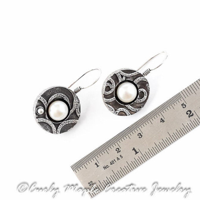 Asymmetrical Textured Silver Pearl Earrings with a ruler for scale