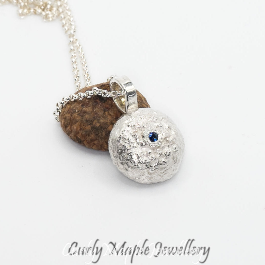 The back of Organic Acorn Cap Chrysocolla Pendant