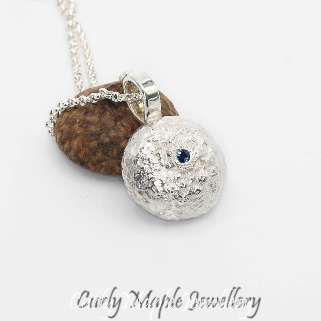The back of Organic Acorn Cap Chrysocolla Pendant