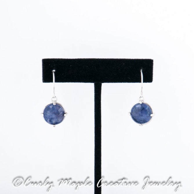 Sodalite Silver Drop Earrings  hanging from a jewelry stand