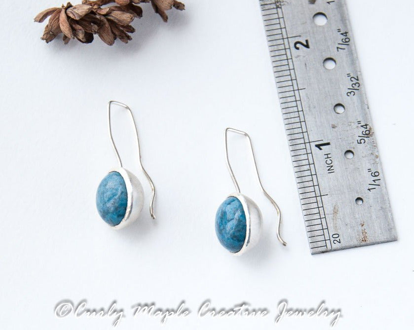 Denim Lapis Silver Dome Earrings with a ruler for scale