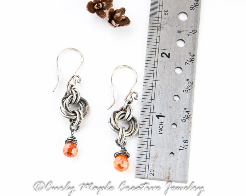 Silver Chainmaille Orange Teardrop Earrings with a ruler fro scale